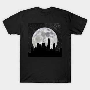 Silhouette of a city against a giant moon T-Shirt